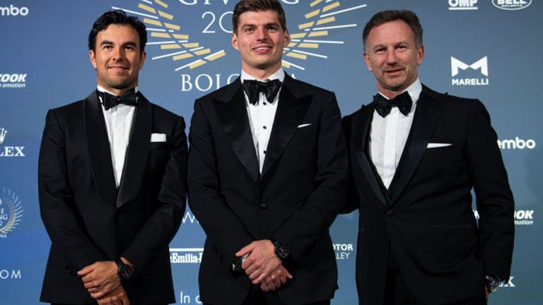 Verstappen with team-mate Sergio Perez (left) and Red Bull boss Christian Horner (right)