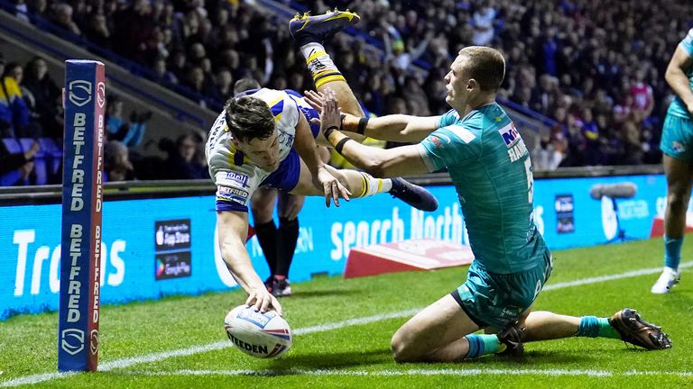 Josh Thewlis dives over for a try in Warrington's Super League season-opening win over Leeds
