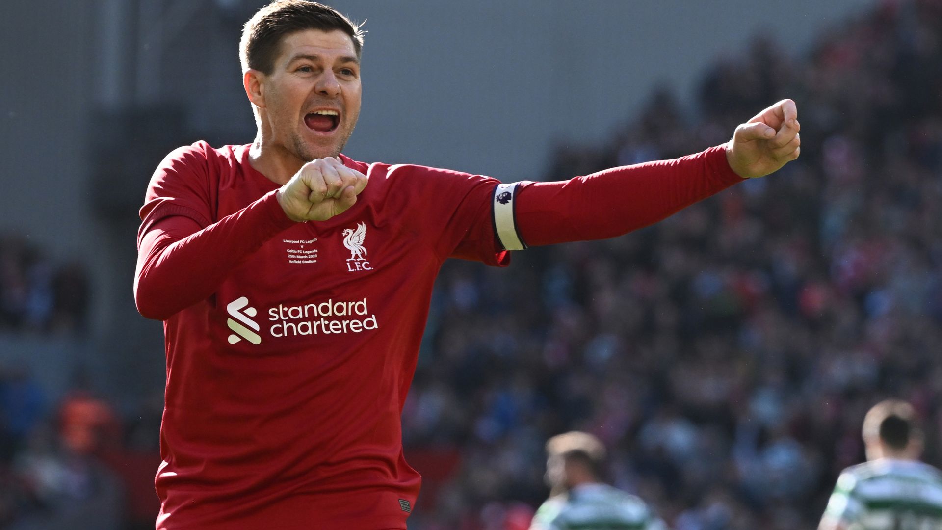 Gerrard celebrates in front of Celtic fans in Liverpool Legends game