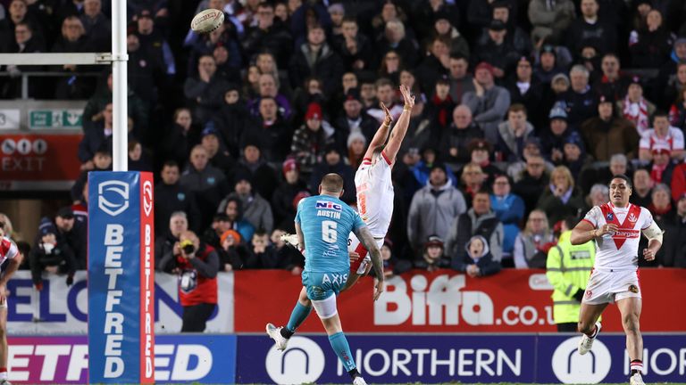 Blake Austin kicks the game-winning drop goal for Leeds against St Helens