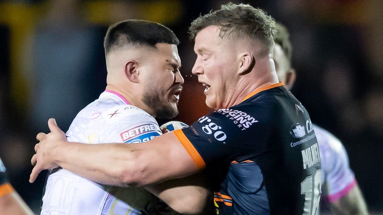 Leeds' James Bentley is tackled by Castleford's Adam Milner