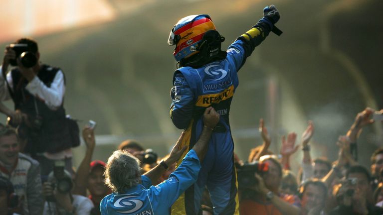 Alonso celebrates with his Renault team during his maiden title-winning campaign in 2005