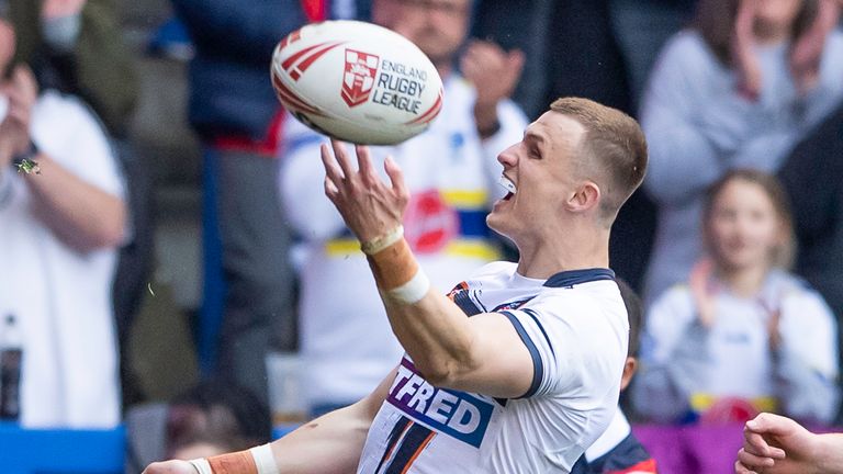 Ash Handley celebrates scoring a try in England's comfortable win over France