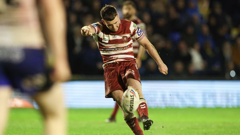 Harry Smith kicks a second-half penalty for Wigan against Warrington