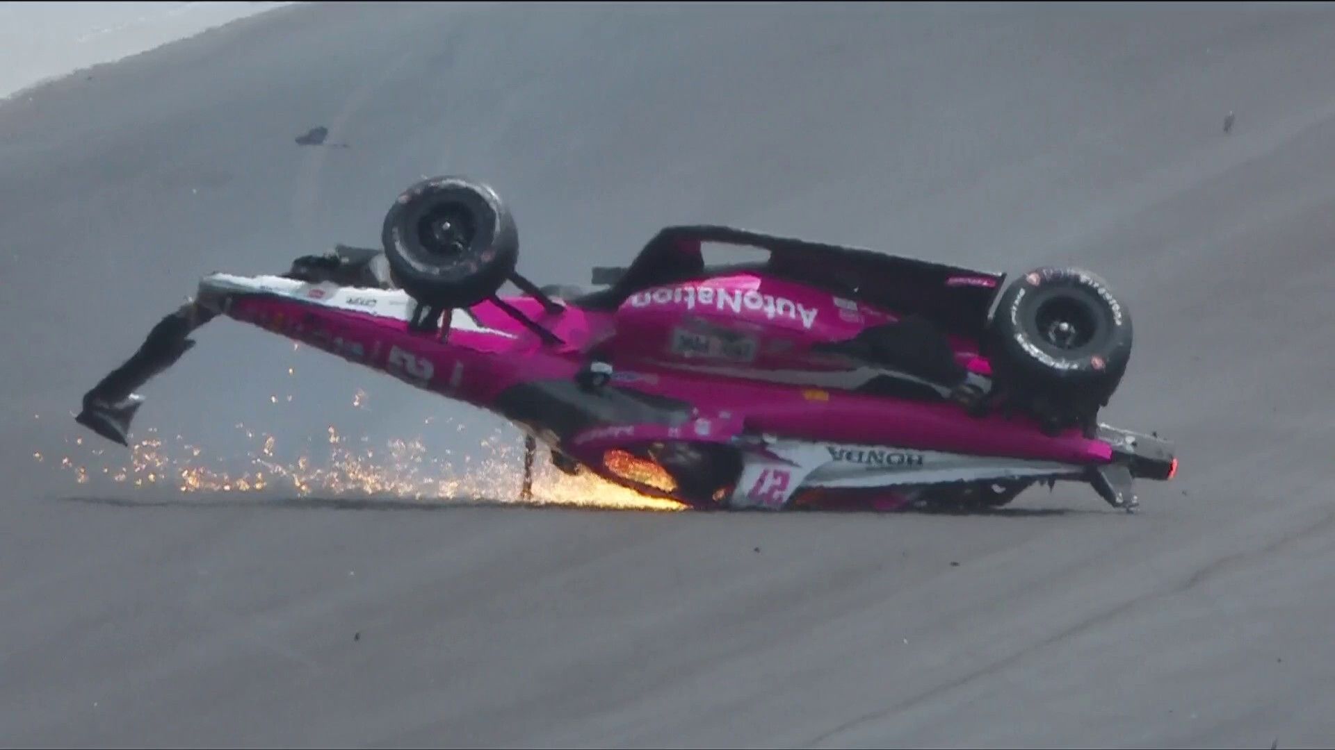 Massive Indy 500 crash sees car flip and tyre fly over grandstand