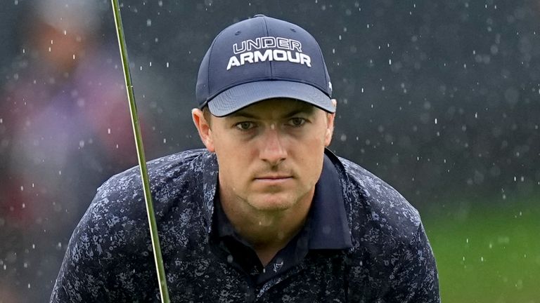 Jordan Spieth lines up a putt in the rain on the 18th hole during the third round of the PGA Championship golf tournament at Oak Hill Country Club on Saturday, May 20, 2023, in Pittsford, N.Y. (AP Photo/Eric Gay)