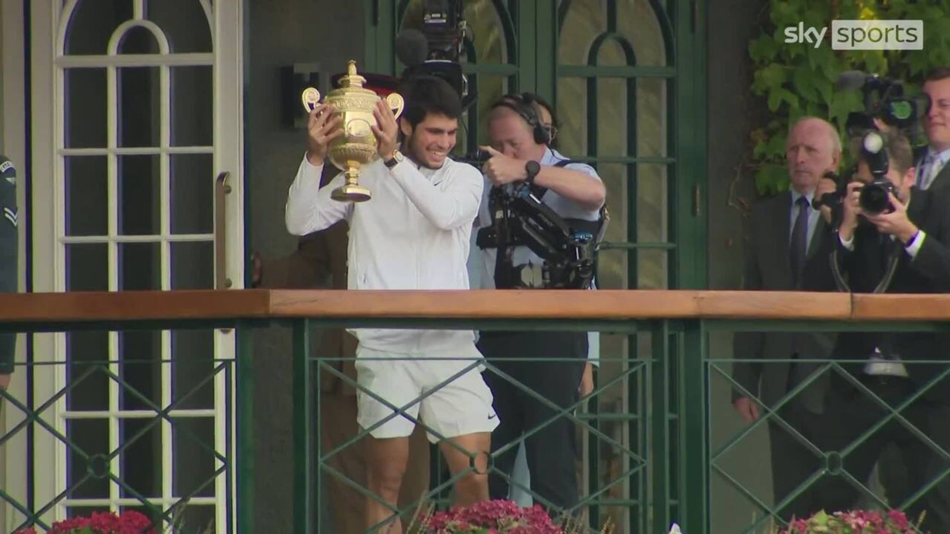 Alcaraz lifts Wimbledon trophy after triumph over Djokovic