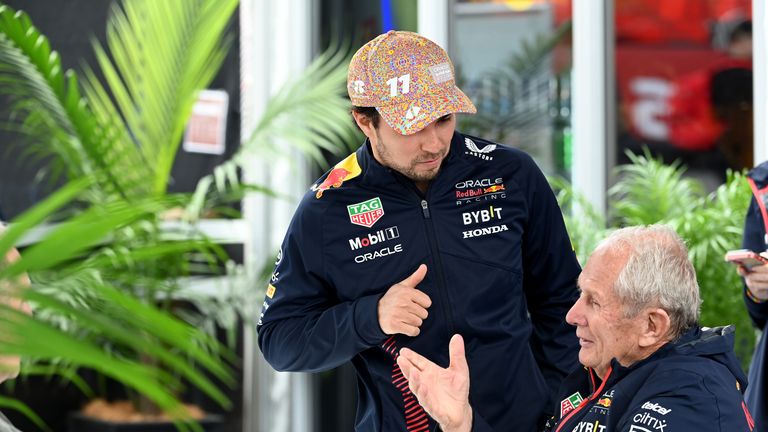 Sergio Perez talks to Helmut Marko as questions continue about the Mexican's future at Red Bull