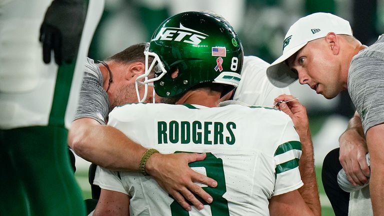 New York Jets quarterback Aaron Rodgers was forced off after just four minutes 