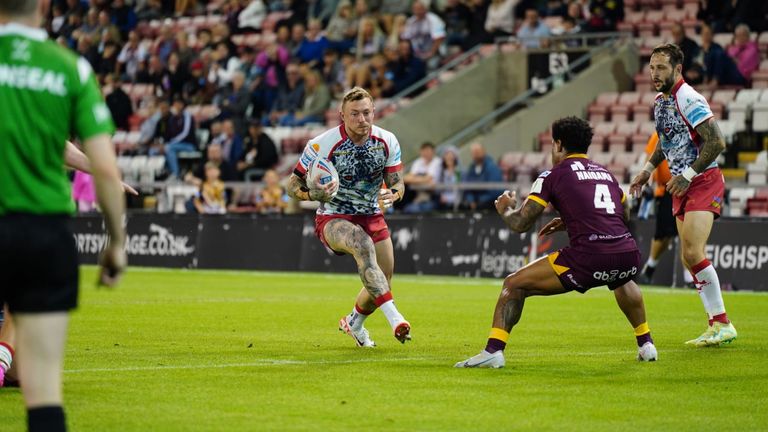 Joshua Charnley carries the ball up the pitch. Credit: Leigh Leopards