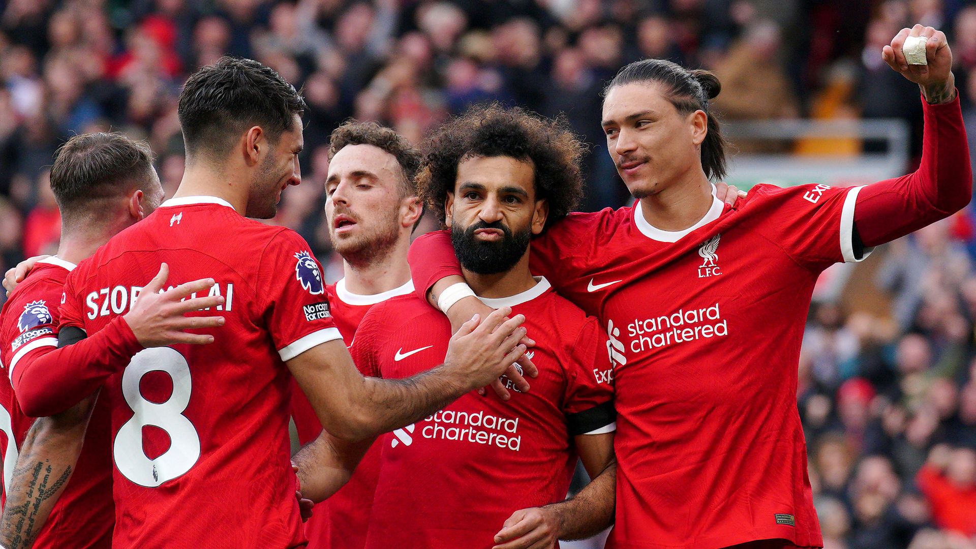Salah goals send Liverpool top with derby win over Everton