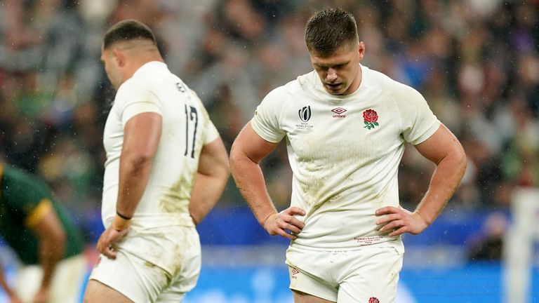 Farrell (right) looks dejected after England lost their Rugby World Cup semi-final against South Africa