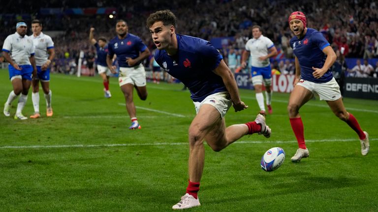 France's Damian Penaud celebrates after scoring the opening try against Italy