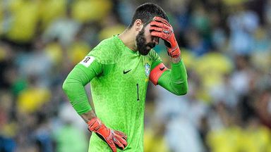 Alisson hangs his head after Brazil are beaten 1-0 by rivals Argentina