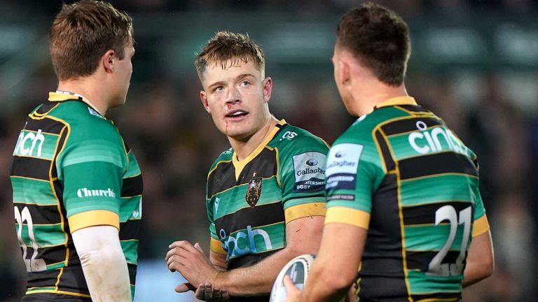 Fin Smith (middle) impressed for Northampton Saints in their home victory on Sunday