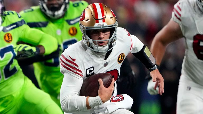 San Francisco 49ers quarterback Brock Purdy rushes during the first half against the Seattle Seahawks