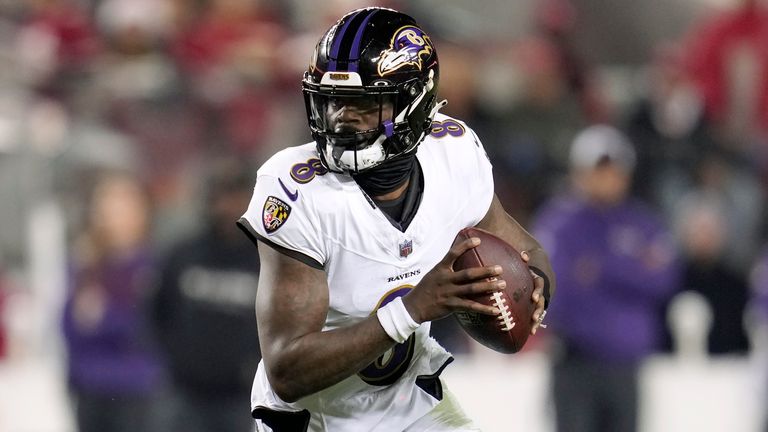 Baltimore Ravens quarterback Lamar Jackson rolls out against the San Francisco 49ers