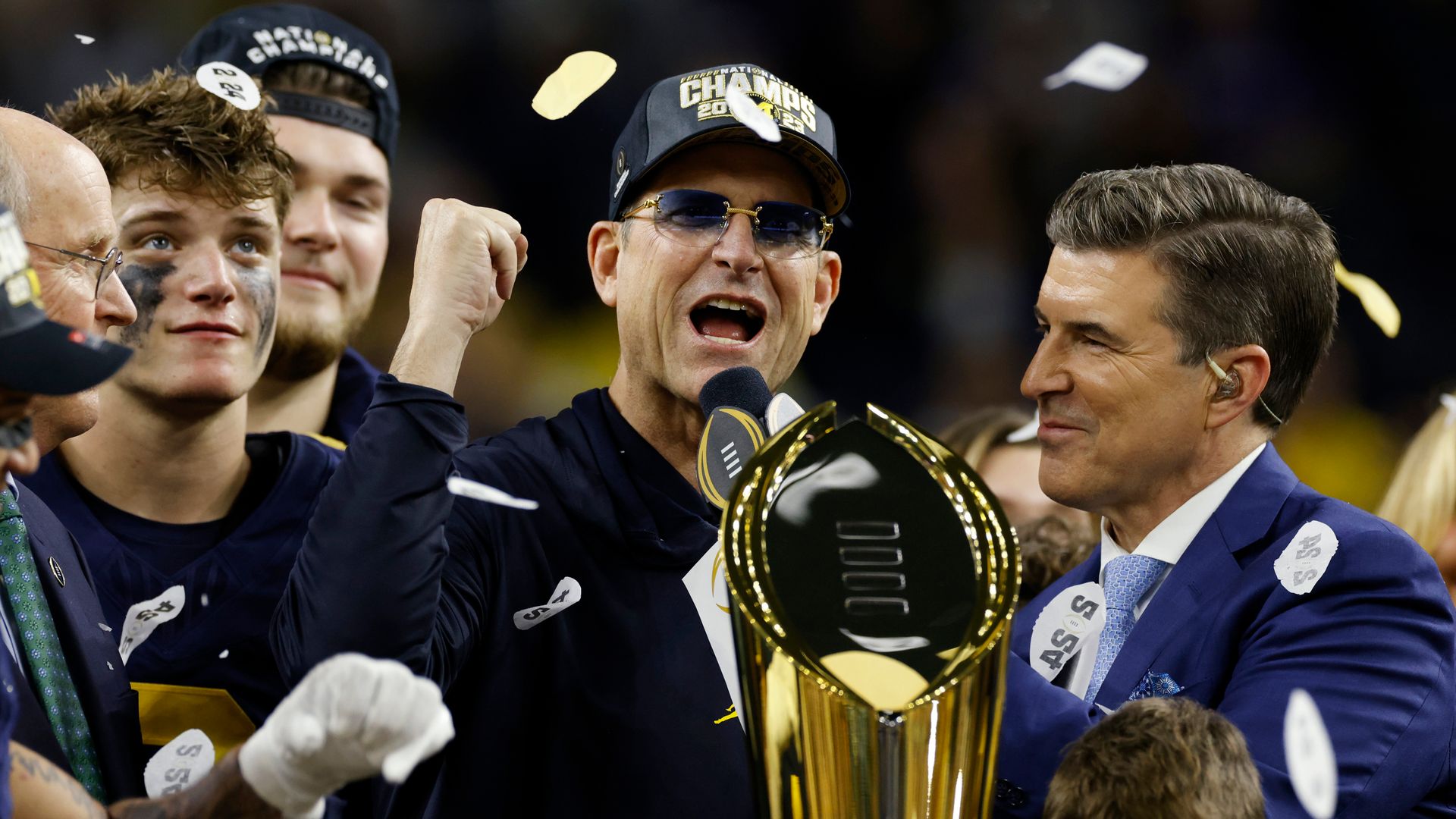 Harbaugh leads Michigan to college title amid NFL links