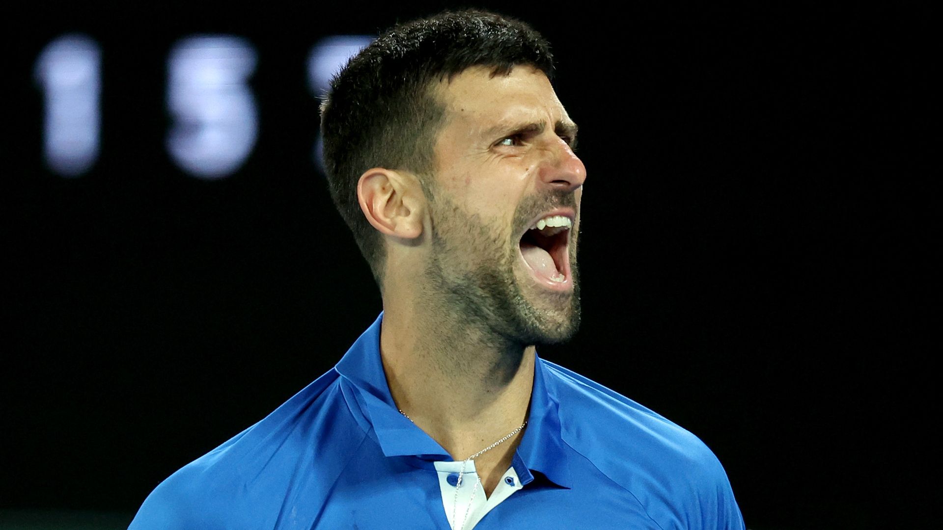 Djokovic battles through in Melbourne and calls out heckler
