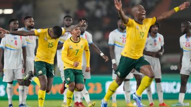 South Africa players celebrate winning the penalty shootout during the African Cup of Nations third-place play-off against DR Congo