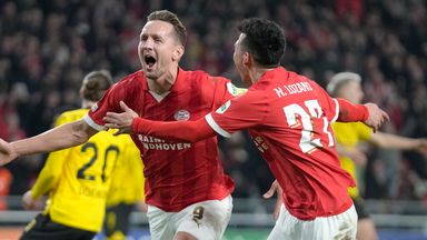 PSV's Luuk de Jong, left, celebrates after scoring his controversial penalty against Dortmund