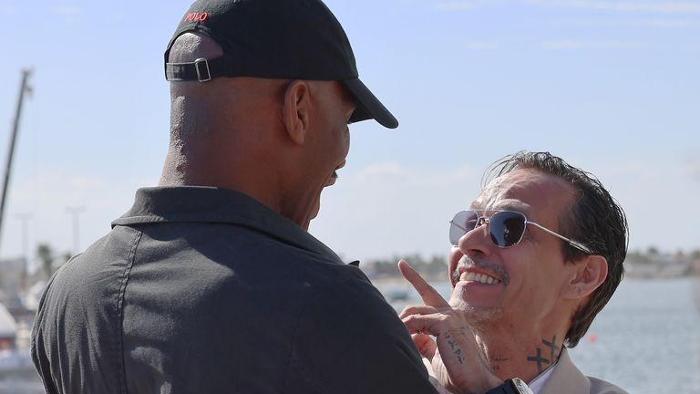 Marc Anthony embraces fellow E1 team owner Drogba