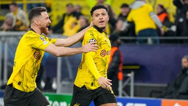Dortmund's Jadon Sancho, right, celebrates after scoring his side's opening goal