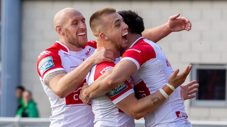 Niall Evalds is congratulated by Dean Hadley and Mikey Lewis after scoring a try for Hull KR against Hull FC