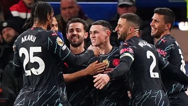 Man City players celebrate after Phil Foden put them 2-0 up at Brighton