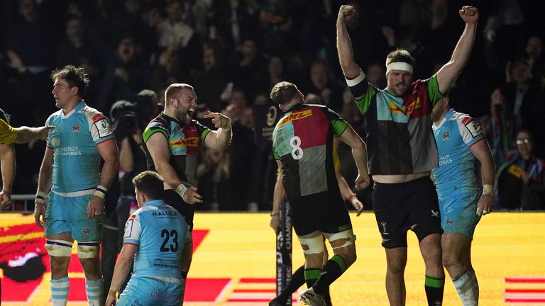 Harlequins players celebrate at full time after holding off Glasgow