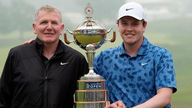 Scotland's Robert MacIntyre, right, and his father and caddie, Dougie MacIntyre, left, pose for photos with the championship trophy after Robert won the Canadian Open golf tournament in Hamilton, Ontario, Sunday, June 2, 2024. (Frank Gunn/The Canadia