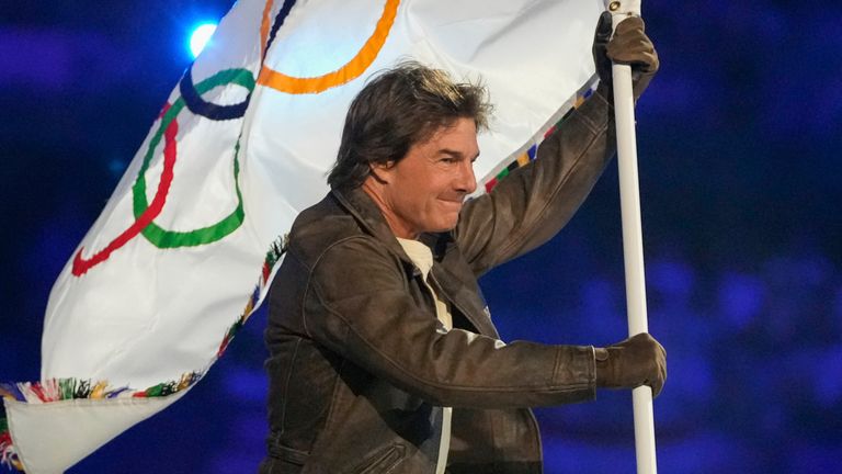 Tom Cruise carries the Olympic flag during the Paris 2024 closing ceremony