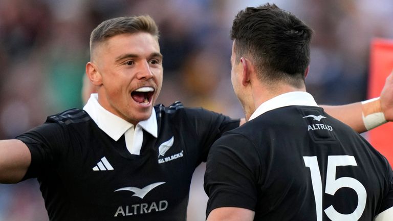 New Zealand's Will Jordan, is congratulated by teammate Cortez Ratima after scoring a try against Australia