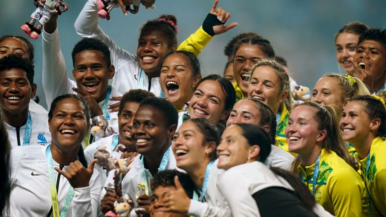 Players from Australia, New Zealand and Fiji pose with their medals following the women's rugby sevens finals during the 2022 Commonwealth Games