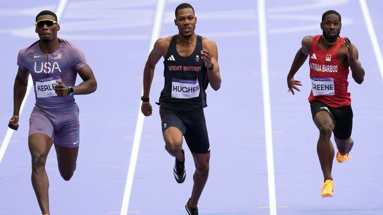 Hughes (centre) in the 100m heats in Paris