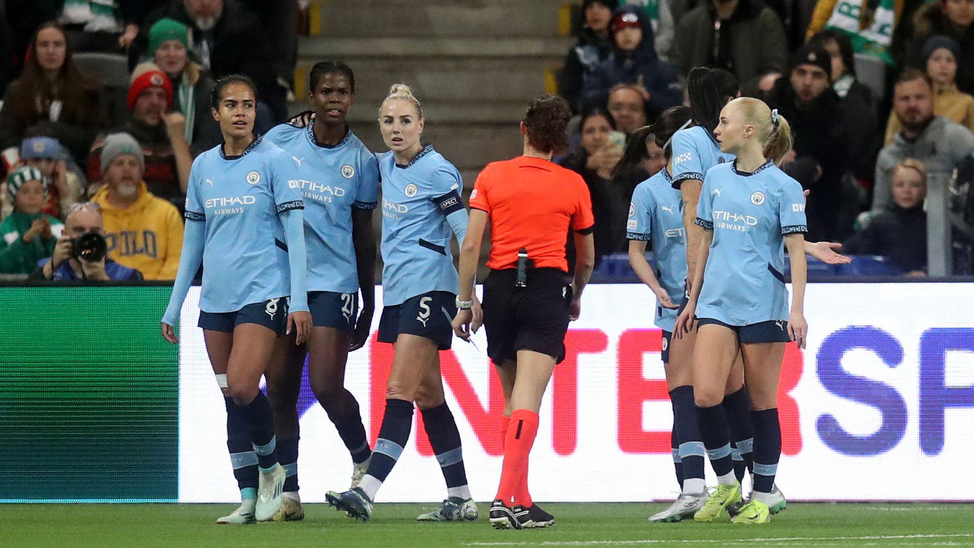 Goalscorer Shaw appears to be struck by object as Man City progress