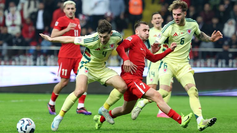 Wales' Ben Davies, left, and Joe Rodon help to keep Turkey at bay