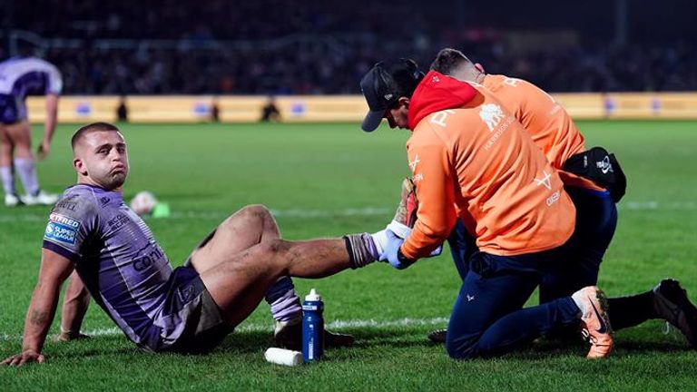 Lewis looked to injure his ankle in the act of scoring the crucial try 