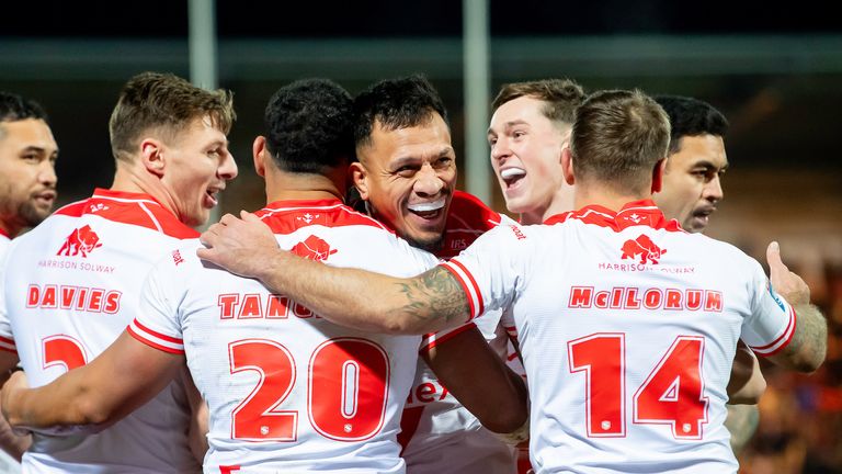 Hull KR's Kelepi Tanginoa is congratulated by team-mates scoring a try against Salford