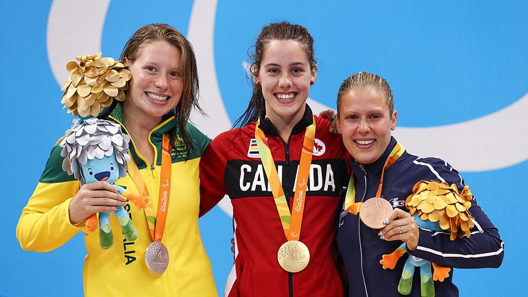 Australia's silver medalist Monique Murphy (L) alongside Canada's gold medalist Aurelie Rivard and France's bronze medalist Elodie Lorandi (R) during the Rio 2016 Games