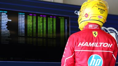 Lewis Hamilton looks at the timing screens after being knocked out of Q2 alongside team-mate Charles Leclerc