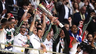 Sunderland's Luke O'Nien, Daniel Neil and manager Regis Le Bris lift the EFL Championship play-off trophy