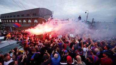 Crystal Palace fans protest with flares and banners at Selhurst Park after being demoted by UEFA to the Conference League