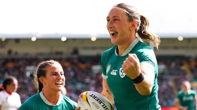 Anna McGann (R) celebrates one of her tries with team-mate Emily Lane (L) in Ireland's quarter-final clinching win