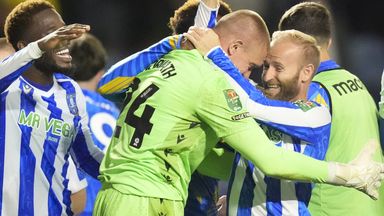 Sheffield Wednesday players Ethan Horvath and Barry Bannan celebrate beating Leeds on penalties in the Carabao Cup second round