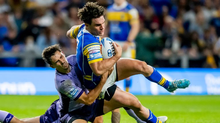 Leeds' Brodie Croft is hauled down by a tackle from Hull KR's Arthur Mourgue (Photo: Allan McKenzie/SWpix.com)