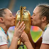 Red Roses captain Zoe Aldcroft (right) and experienced scrum-half Natasha Hunt celebrate Rugby World Cup victory