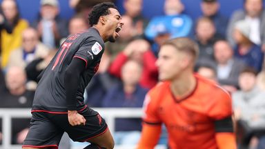 Femi Azeez celebrates after giving Millwall the lead at Loftus Road