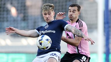 Harry Winks of Leicester City in action with Luke Cundle of Millwall