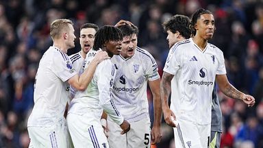 Manchester United players celebrate their win over Liverpool